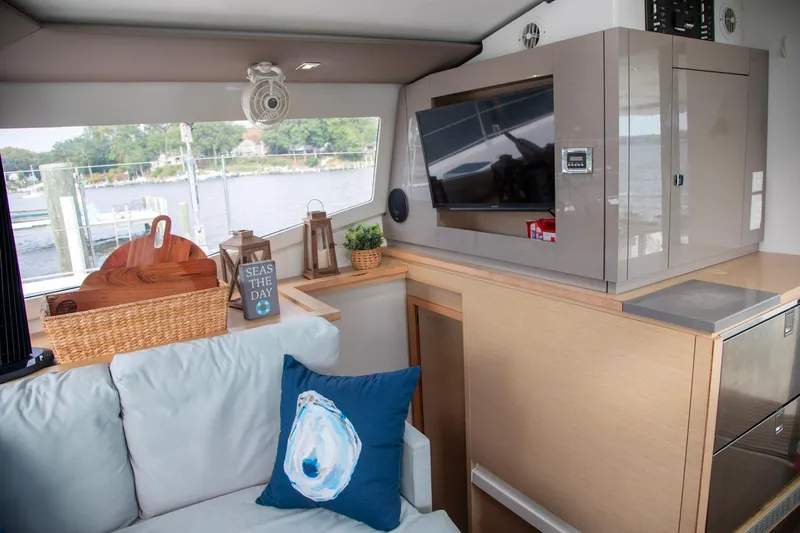Sweet And Salty Yacht Photos Pics 2018 Fountaine Pajot Helia 44 Evolution interior with modern decor and scenic window view.