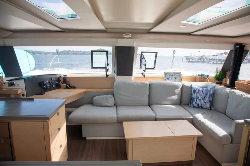 Sweet And Salty Yacht Photos Pics Luxurious interior of 2018 Fountaine Pajot Helia 44 Evolution catamaran with spacious seating and scenic views.