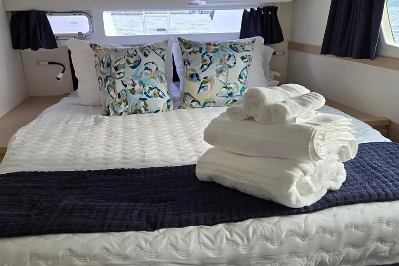 Sweet And Salty Yacht Photos Pics Luxurious cabin interior of 2018 Fountaine Pajot Helia 44 Evolution with cozy bedding.