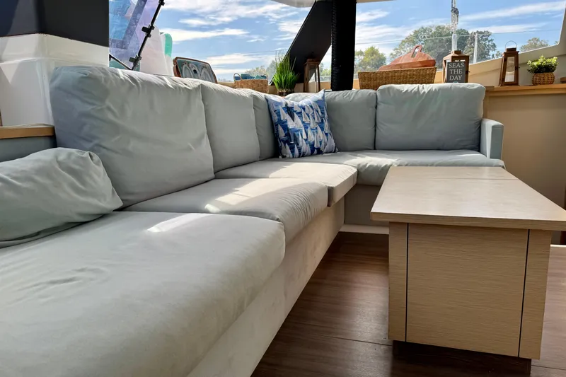 Sweet And Salty Yacht Photos Pics Luxurious interior of 2018 Fountaine Pajot Helia 44 Evolution catamaran with cozy seating area.