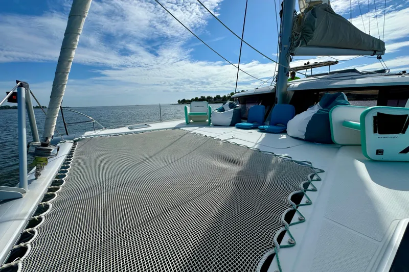 Sweet And Salty Yacht Photos Pics 2018 Fountaine Pajot Helia 44 Evolution catamaran on calm waters under a blue sky.