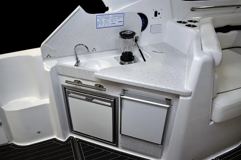  Yacht Photos Pics Manufacturer Provided Image: 2018 Rinker EX 370 boat kitchenette with sink, blender, and storage compartments.