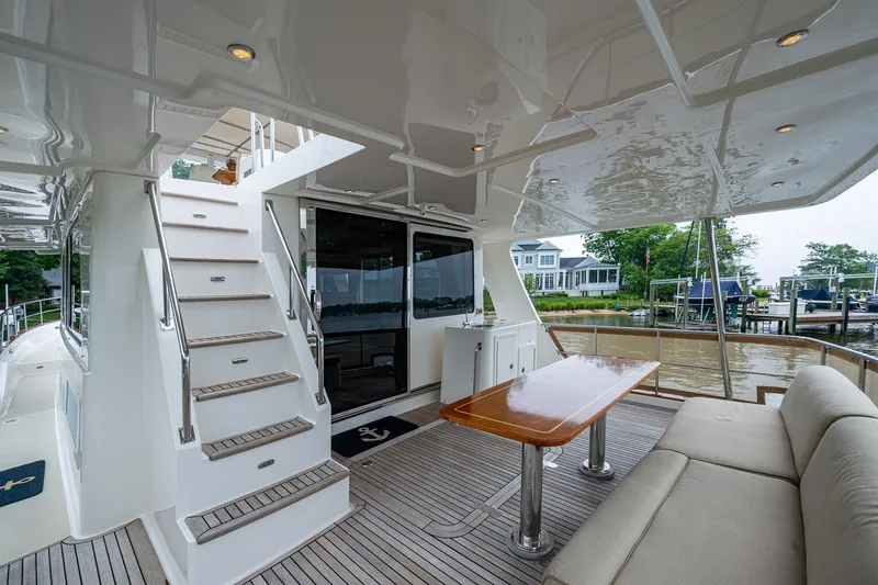 Venture Yacht Photos Pics Grand Banks 54 Europa 2014 yacht with outdoor seating and table on deck.