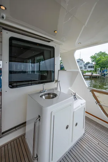 Venture Yacht Photos Pics 2014 Grand Banks 54 Europa yacht deck with sink and cabinetry.
