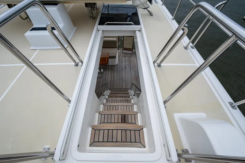 Venture Yacht Photos Pics Stairway on 2014 Grand Banks 54 Europa yacht, leading to lower deck with wooden steps.