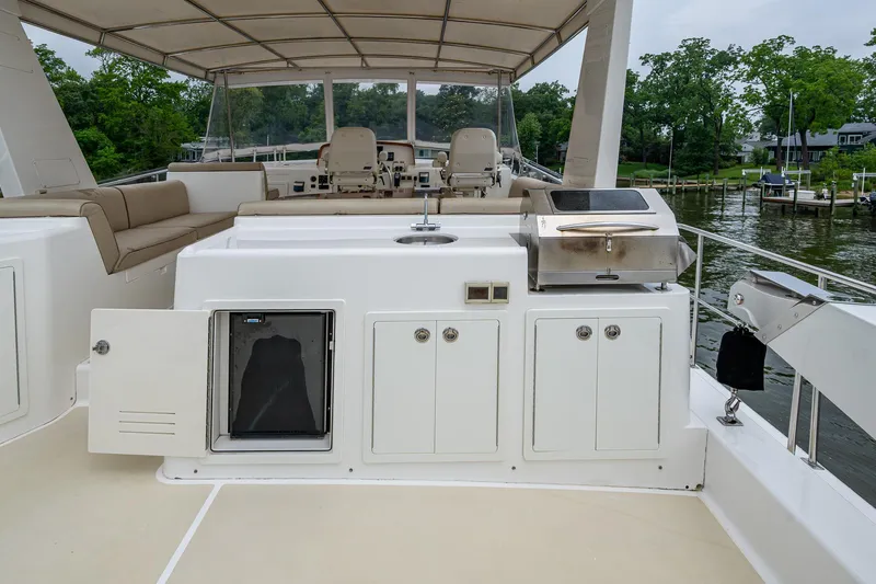 Venture Yacht Photos Pics 2014 Grand Banks 54 Europa yacht deck with seating and outdoor kitchen amenities.