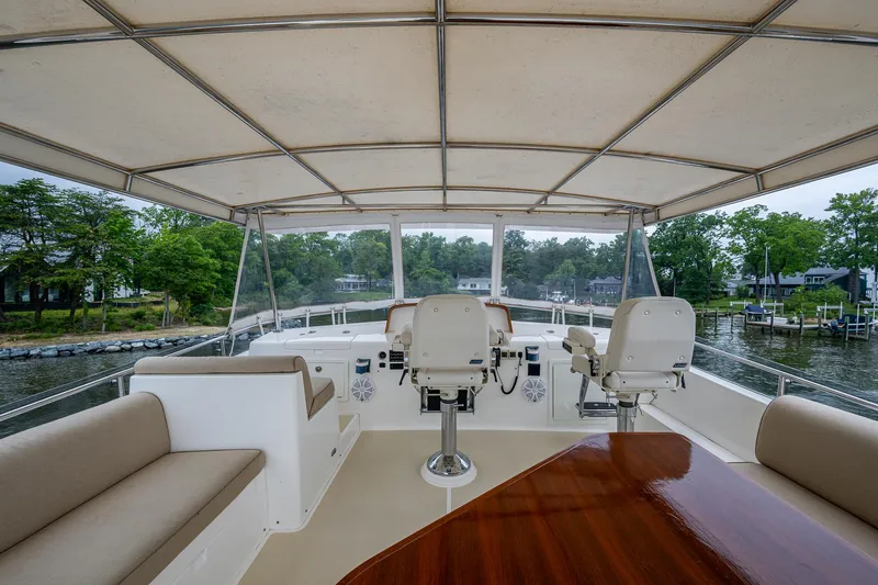 Venture Yacht Photos Pics Flybridge of 2014 Grand Banks 54 Europa yacht with seating and helm chairs.