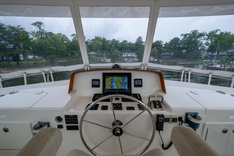 Venture Yacht Photos Pics Helm of 2014 Grand Banks 54 Europa yacht with navigation equipment and steering wheel.