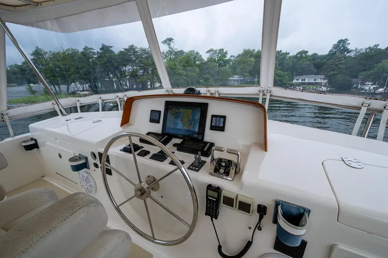 Venture Yacht Photos Pics Helm of 2014 Grand Banks 54 Europa yacht with navigation equipment and steering wheel.