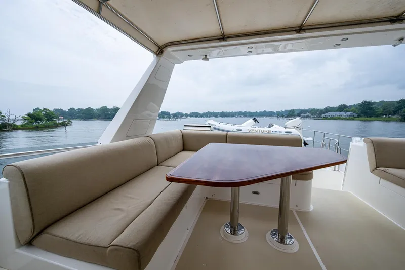 Venture Yacht Photos Pics Luxurious seating area on 2014 Grand Banks 54 Europa yacht with scenic water view.