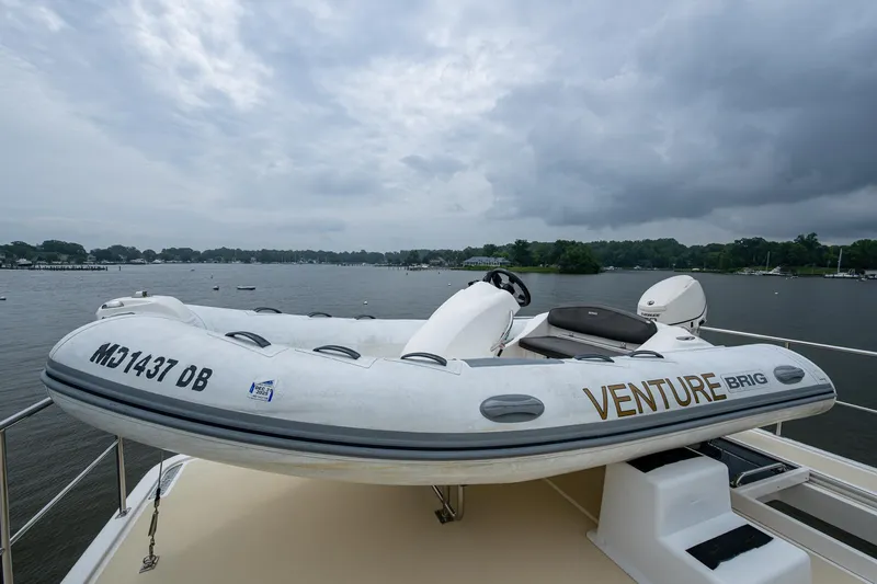 Venture Yacht Photos Pics Inflatable boat on Grand Banks 54 Europa yacht, 2014 model, docked by a scenic lake.