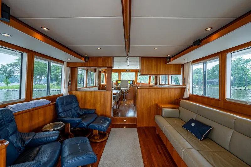 Venture Yacht Photos Pics Luxurious interior of 2014 Grand Banks 54 Europa yacht with leather seating and wood paneling.