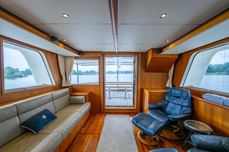 Venture Yacht Photos Pics Luxurious interior of 2014 Grand Banks 54 Europa yacht with leather seating and scenic windows.