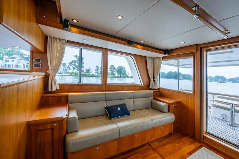 Venture Yacht Photos Pics Luxurious interior of 2014 Grand Banks 54 Europa yacht with elegant wood finish and comfortable seating.