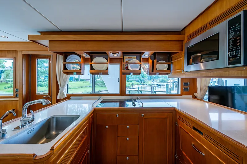 Venture Yacht Photos Pics Luxurious kitchen interior of 2014 Grand Banks 54 Europa yacht with modern amenities.