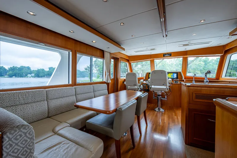 Venture Yacht Photos Pics Luxurious interior of 2014 Grand Banks 54 Europa yacht with elegant seating and helm.