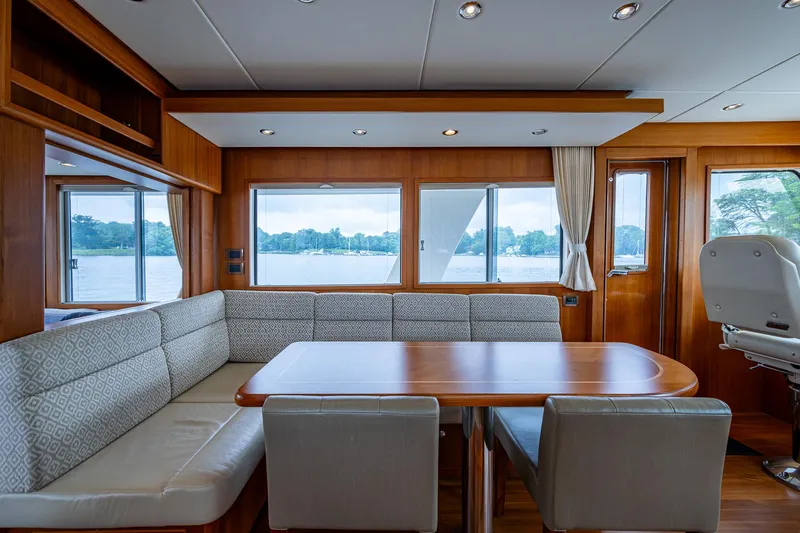 Venture Yacht Photos Pics Luxurious interior of 2014 Grand Banks 54 Europa yacht with elegant dining area.