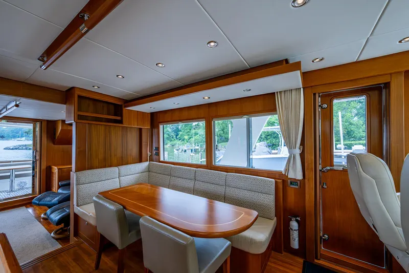 Venture Yacht Photos Pics Luxurious interior of 2014 Grand Banks 54 Europa yacht with elegant wood finishes.