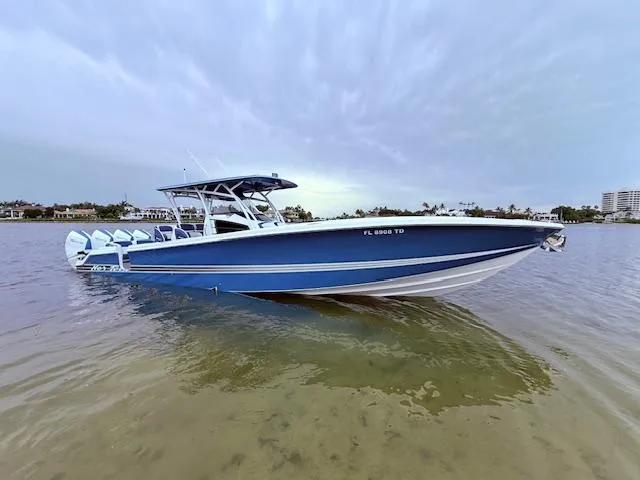  Yacht Photos Pics 2022 Nor-Tech 390 Sport Center Console boat on calm water, showcasing sleek blue design.