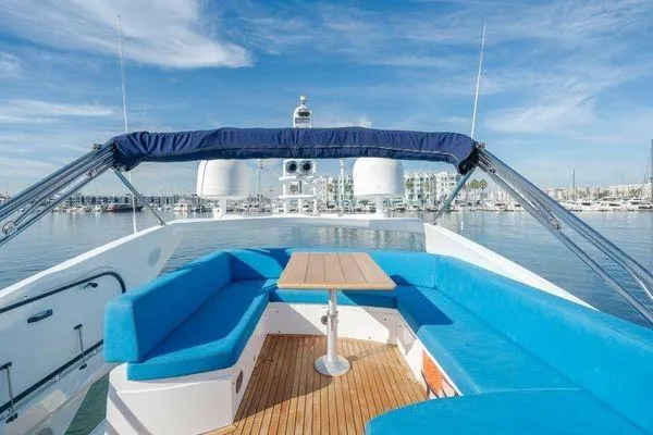 Zenyatta Yacht Photos Pics Luxurious 2010 Sunseeker Manhattan 60 yacht with spacious deck and blue seating.