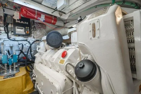 Zenyatta Yacht Photos Pics Engine room of 2010 Sunseeker Manhattan 60 yacht with MAN engine and fire extinguisher.