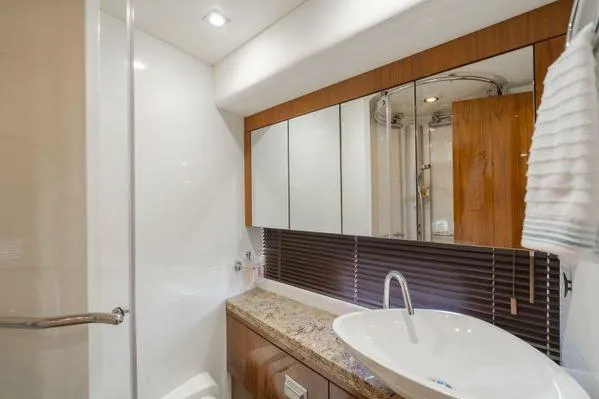 Zenyatta Yacht Photos Pics Luxurious bathroom in 2010 Sunseeker Manhattan 60 yacht with modern fixtures and elegant design.