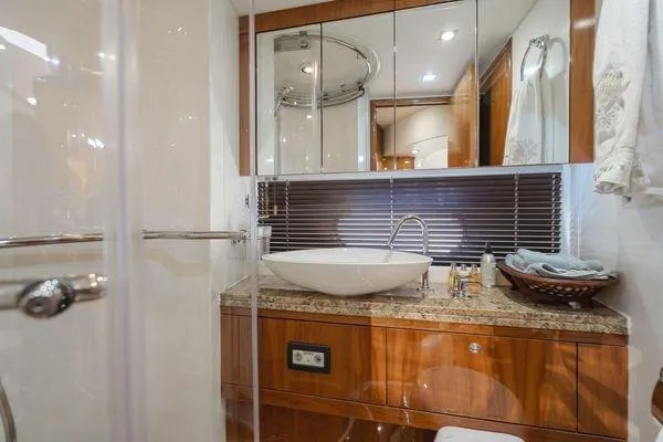 Zenyatta Yacht Photos Pics Luxurious bathroom in 2010 Sunseeker Manhattan 60 yacht with modern fixtures and elegant design.