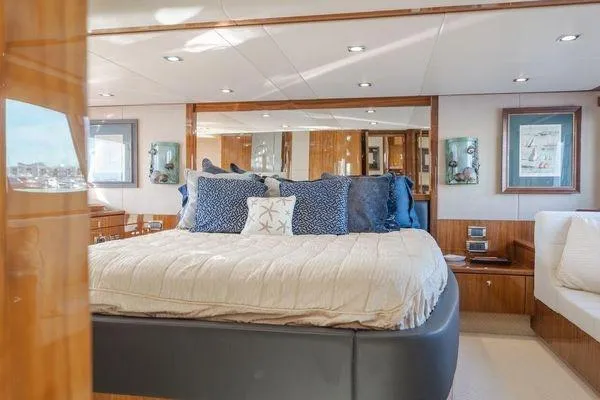 Zenyatta Yacht Photos Pics Luxurious bedroom interior of 2010 Sunseeker Manhattan 60 yacht with elegant decor.