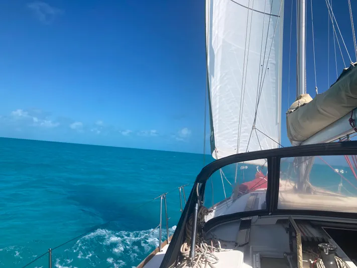 Caff&Eacute; Latte Yacht Photos Pics Sailing on a 2013 Dufour 410 Grand Large in clear blue waters.