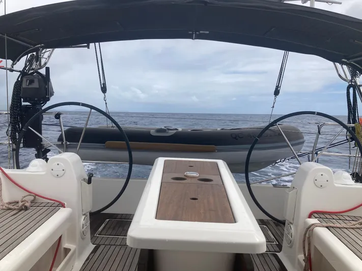 Caff&Eacute; Latte Yacht Photos Pics Cockpit view of 2013 Dufour 410 Grand Large sailboat with ocean backdrop.