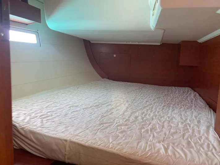 Caff&Eacute; Latte Yacht Photos Pics Cabin interior of 2013 Dufour 410 Grand Large with spacious bed and wooden finish.