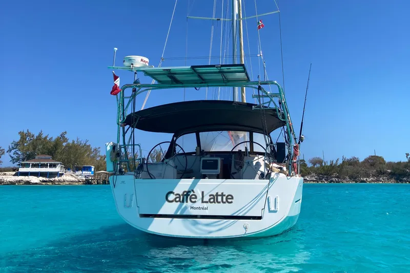Caff&Eacute; Latte Yacht Photos Pics Dufour 410 Grand Large 2013 sailboat "Caff&egrave; Latte" on turquoise water, clear blue sky.
