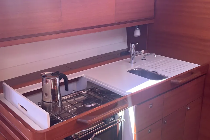Caff&Eacute; Latte Yacht Photos Pics Modern kitchen in 2013 Dufour 410 Grand Large yacht with stove and sink.