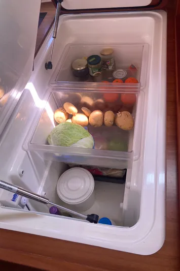 Caff&Eacute; Latte Yacht Photos Pics Refrigerator on 2013 Dufour 410 Grand Large yacht with vegetables and jars.