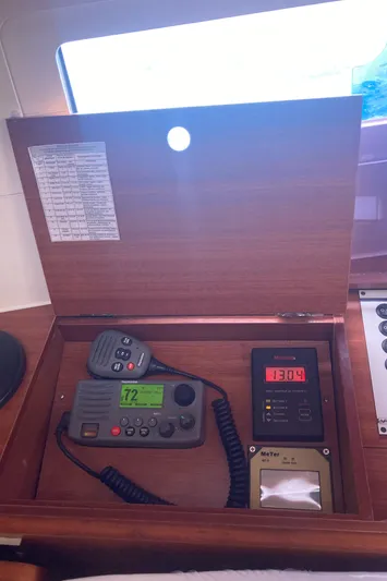 Caff&Eacute; Latte Yacht Photos Pics Control panel inside a 2013 Dufour 410 Grand Large yacht, featuring communication and navigation equipment.