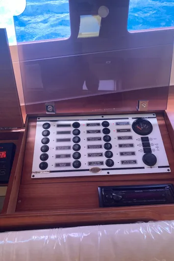 Caff&Eacute; Latte Yacht Photos Pics Control panel of a 2013 Dufour 410 Grand Large yacht, featuring various switches and dials.