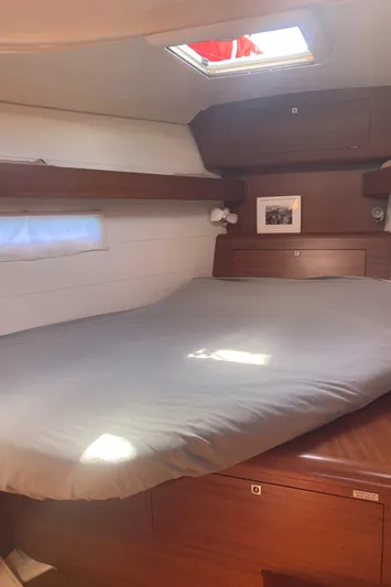 Caff&Eacute; Latte Yacht Photos Pics Cozy cabin interior of 2013 Dufour 410 Grand Large sailboat with wooden finish.