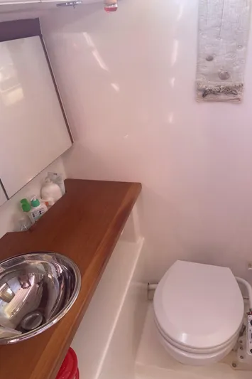 Caff&Eacute; Latte Yacht Photos Pics Bathroom interior of 2013 Dufour 410 Grand Large yacht with sink and toilet.