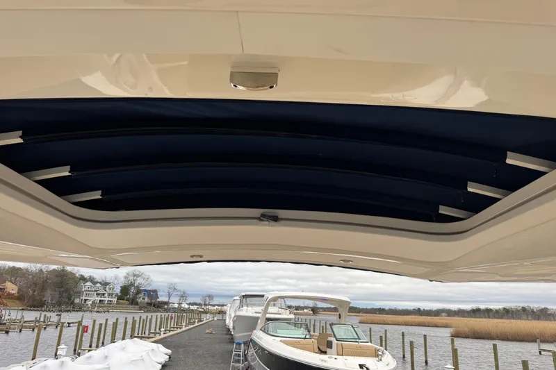  Yacht Photos Pics 2021 Sea Ray SLX 310 boat docked, view from under the canopy.