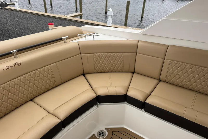  Yacht Photos Pics Luxurious seating on 2021 Sea Ray SLX 310 boat, featuring tan upholstery and diamond stitching.