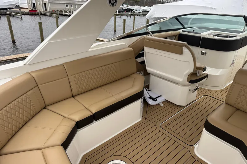 Yacht Photos Pics Luxurious interior of 2021 Sea Ray SLX 310 boat with tan leather seating.