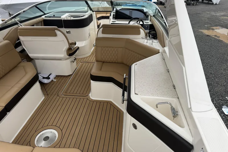 Yacht Photos Pics Luxurious interior of 2021 Sea Ray SLX 310 boat with tan seating and sleek design.