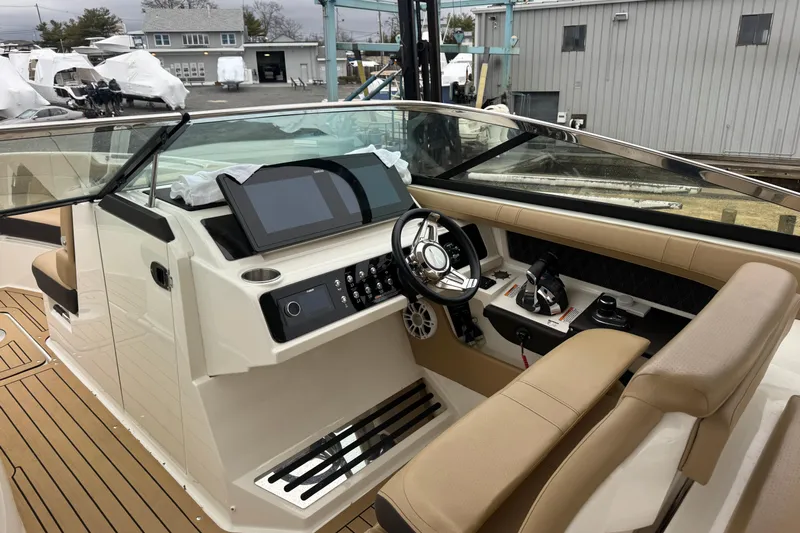  Yacht Photos Pics 2021 Sea Ray SLX 310 boat interior with modern dashboard and steering wheel.