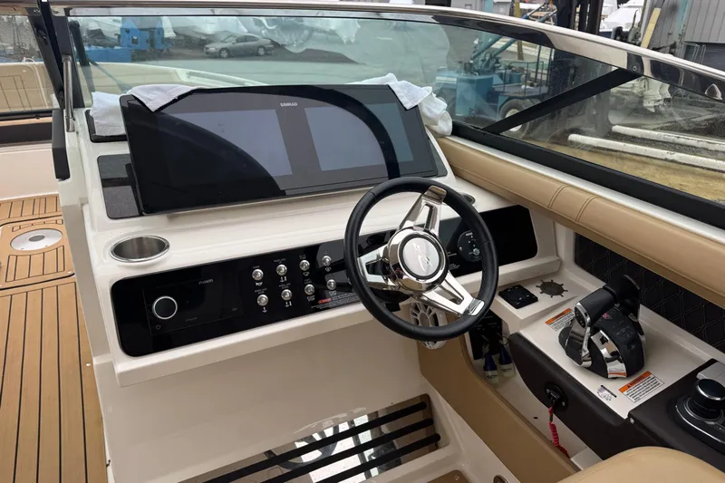  Yacht Photos Pics 2021 Sea Ray SLX 310 boat dashboard with steering wheel and control panel.