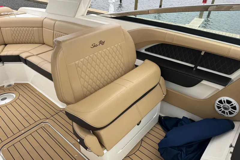  Yacht Photos Pics Luxurious interior of 2021 Sea Ray SLX 310 boat with tan leather seating.