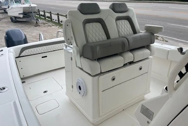  Yacht Photos Pics 2023 World Cat 280 CC-X boat interior with dual cushioned seats and storage.