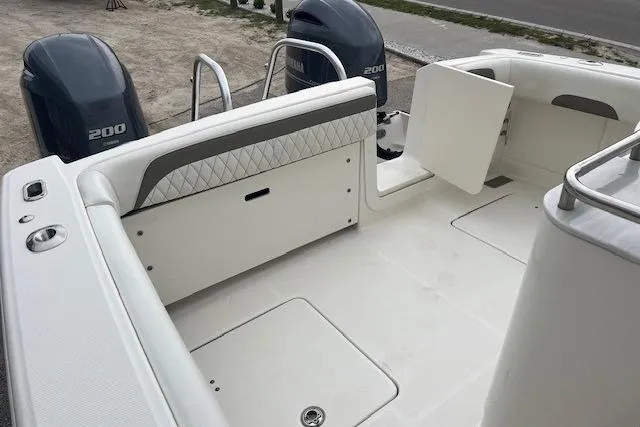  Yacht Photos Pics 2023 World Cat 280 CC-X boat interior with twin 200 engines, featuring spacious deck layout.