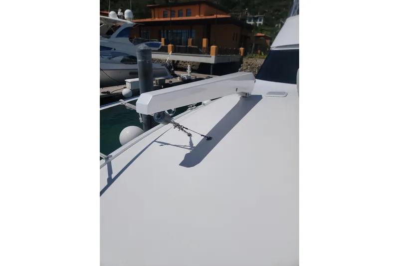  Yacht Photos Pics 2012 Viking 64c yacht detail with docked boats in background.