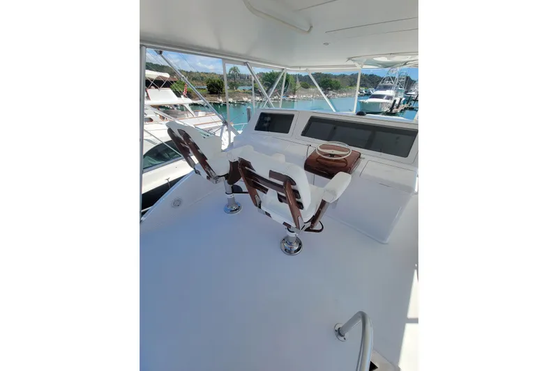  Yacht Photos Pics 2012 Viking 64c yacht helm with dual captain chairs and navigation equipment.