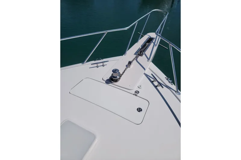  Yacht Photos Pics Bow of 2012 Viking 64c yacht with anchor chain and railing.